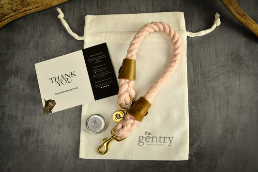 Handmade Pastel Pink Rope Dog Collar. Plastic free, 100% cotton rope with leaf green leather sleeves.