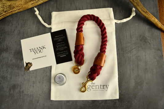 Handmade Burgundy Rope Dog Collar. Plastic free, 100% cotton rope with light tan leather sleeves.