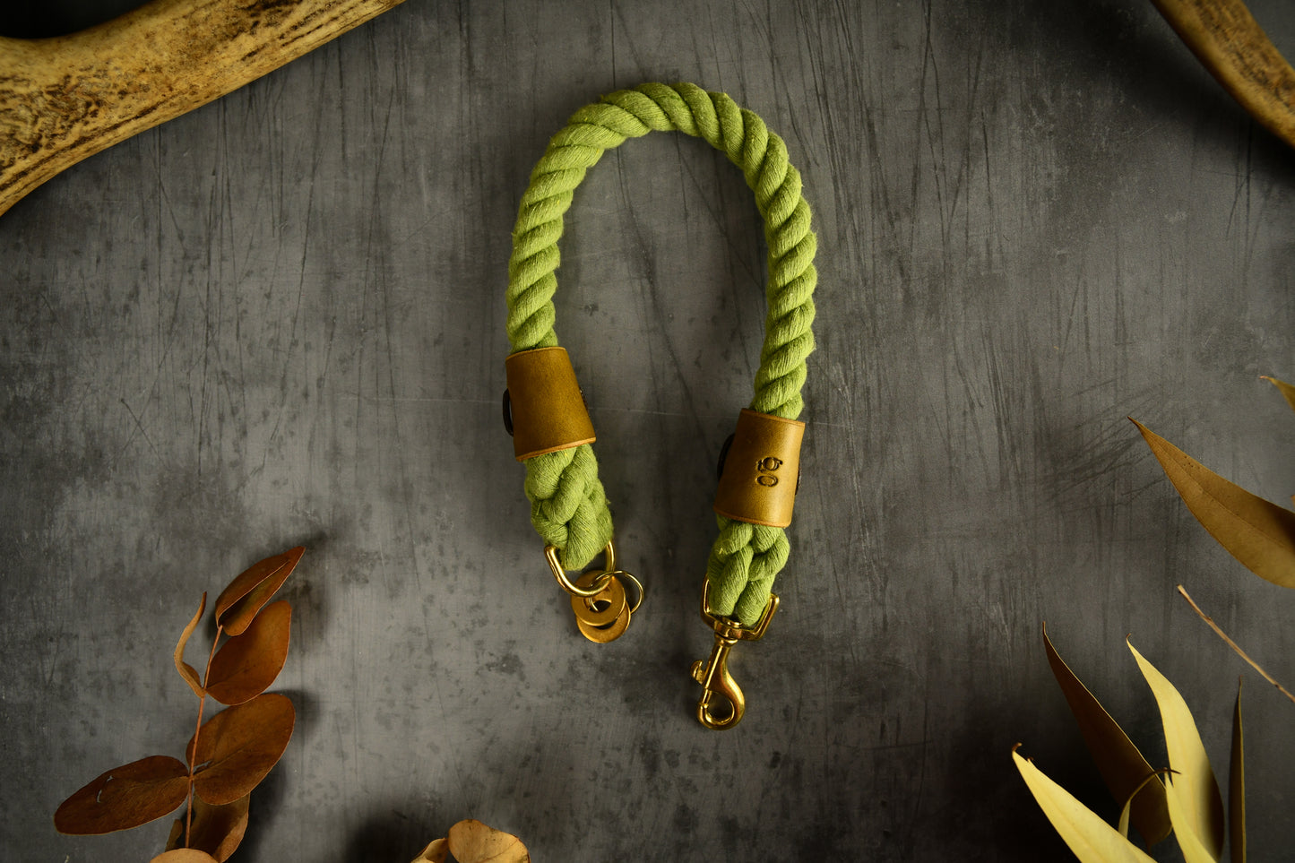 Handmade Olive Green Rope Dog Collar. Plastic free, 100% cotton rope with leaf green leather sleeves.