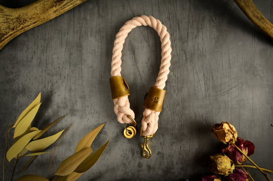 Handmade Pastel Pink Rope Dog Collar. Plastic free, 100% cotton rope with leaf green leather sleeves.