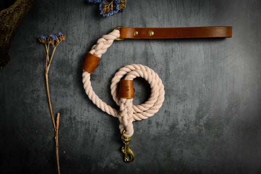 Handcrafted Pastel Pink Lead with Tan Leather Sleeves.