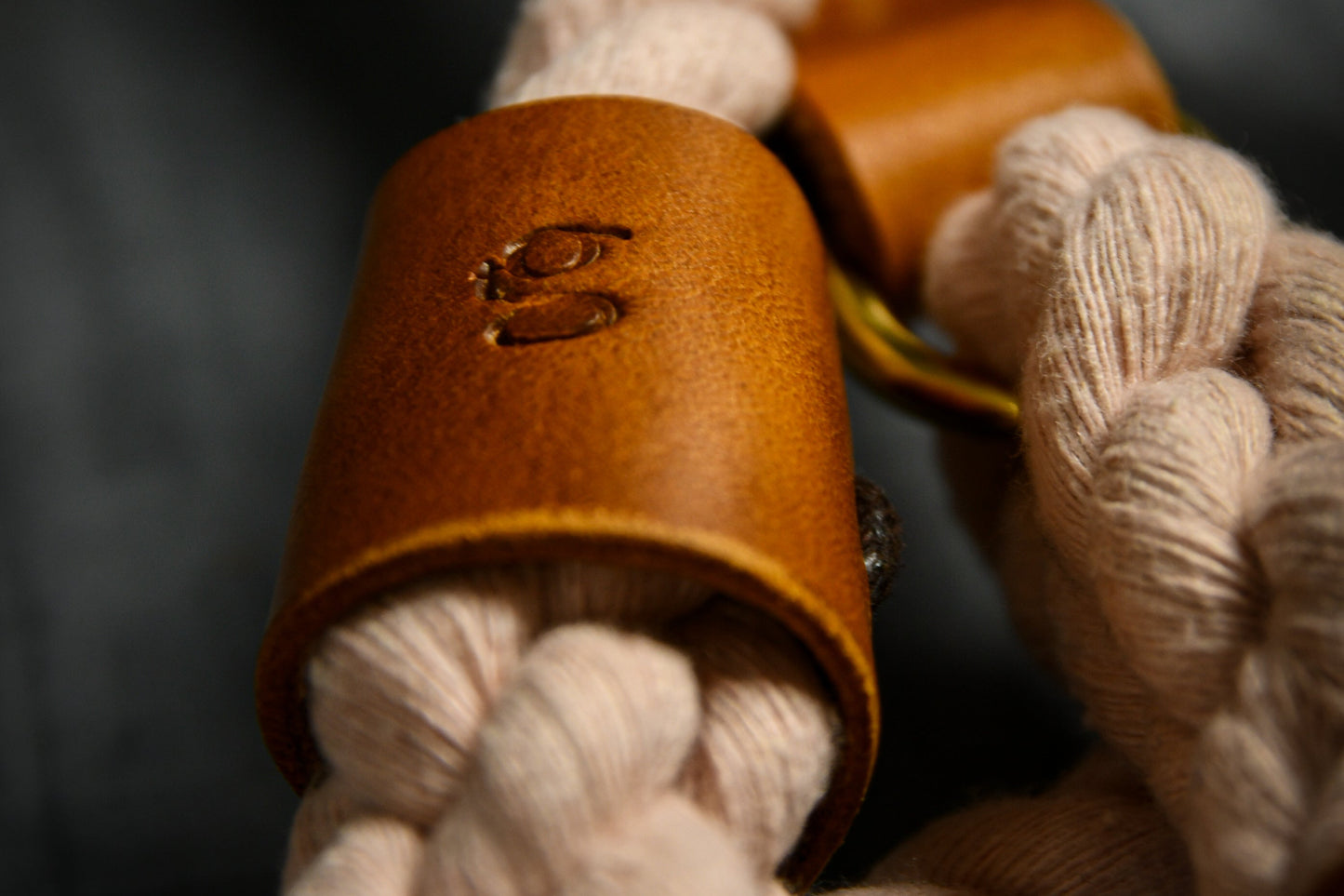 Handcrafted Pastel Pink Lead with Tan Leather Sleeves.